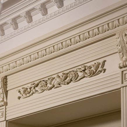 Detail of carved plaster cornice and dentil molding