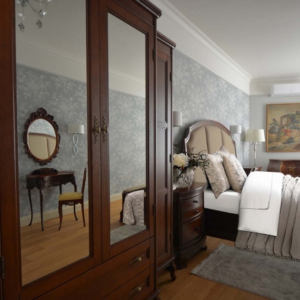 Bedroom corner with vanity table, mirror, soft textile, ambient lighting