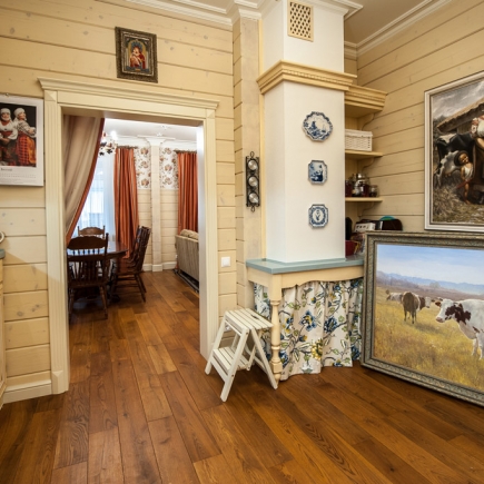 Provençal dining area with farmhouse table and linen upholstery
