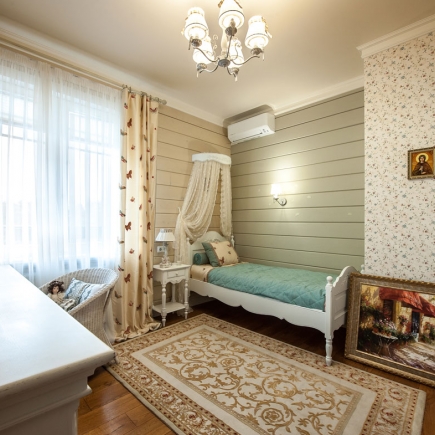 Provençal hallway with wooden console and framed botanical prints