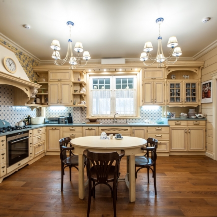Provençal kitchen with rustic wooden furniture and natural light