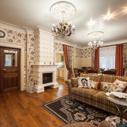 Provençal living room interior with fireplace and natural stone walls
