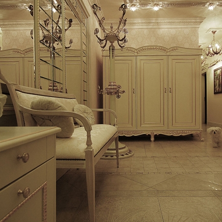 Entrance hall with a mirror-panelled wardrobe wall, a bench and chandeliers over marble tile