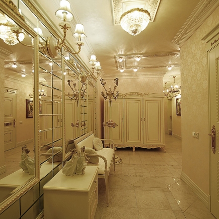 Panorama of the classical kitchen with white gilded cabinetry, mosaic backsplash and a dining nook