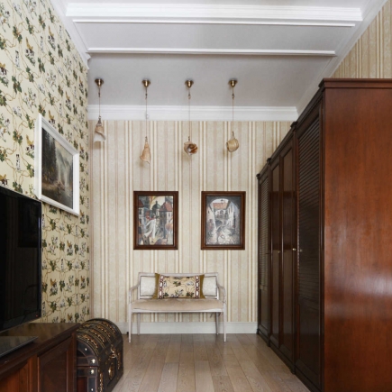 Powder room with floral wallpaper, a wall-mounted toilet, and a lace-trimmed hamper