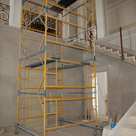 Scaffolding tower set up inside the stairwell during interior finishing work