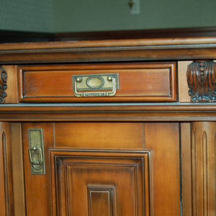 Close-up of the antique brass drawer pull and cabinet hardware