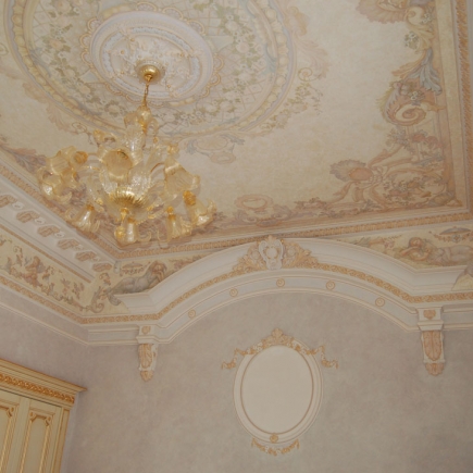 Painted fresco ceiling medallion with a Murano glass chandelier