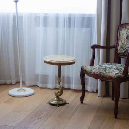 Home office with antique desk and brass lamp