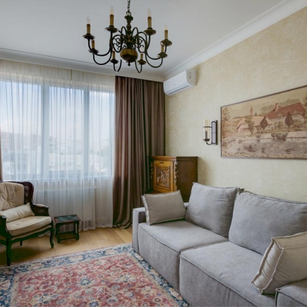 Master bedroom with canopy bed and elegant textiles