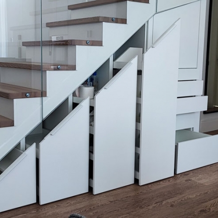 Staircase with built-in pull-out storage drawers beneath the wood treads