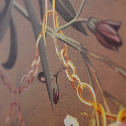 Close-up detail of the bird-and-floral wallpaper pattern with a gold chain motif