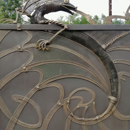 Detail of the hand-forged scrollwork pattern on the entrance gate