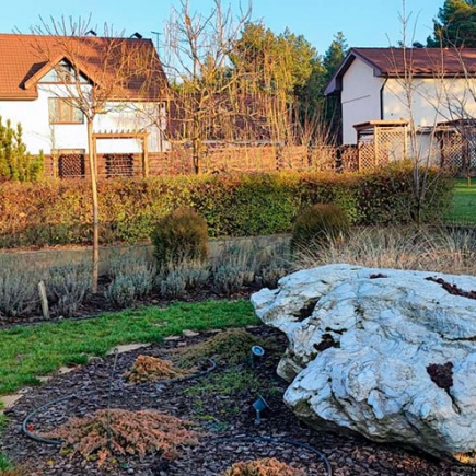 Large white boulder accent set among the winter garden borders