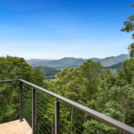 Deck cable railing overlooking the wooded valley and Blue Ridge Mountains