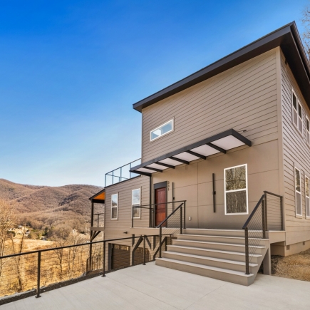 Skyline Ridge House — rear exterior with mountain view and entry stairs